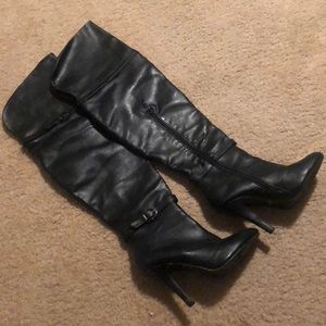 thigh high heeled black leather boots